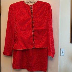 Red suit, size 12, with five buttons, no pockets, see photos for trim